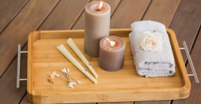 candles in a tray with cotton buds, matches and a towel